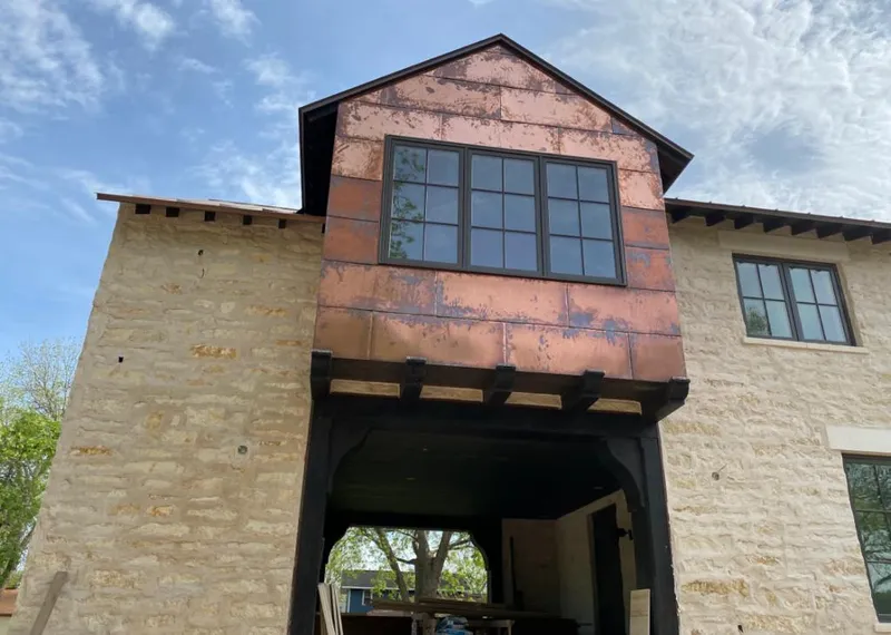 Copper metal panel facade on a stone building for Skylight Installation in Gaithersburg